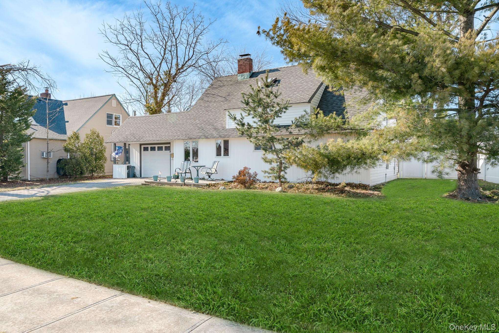 44 Disc Lane Wantagh, NY 11793 - Photo 3 of 26 a view of house with a yard