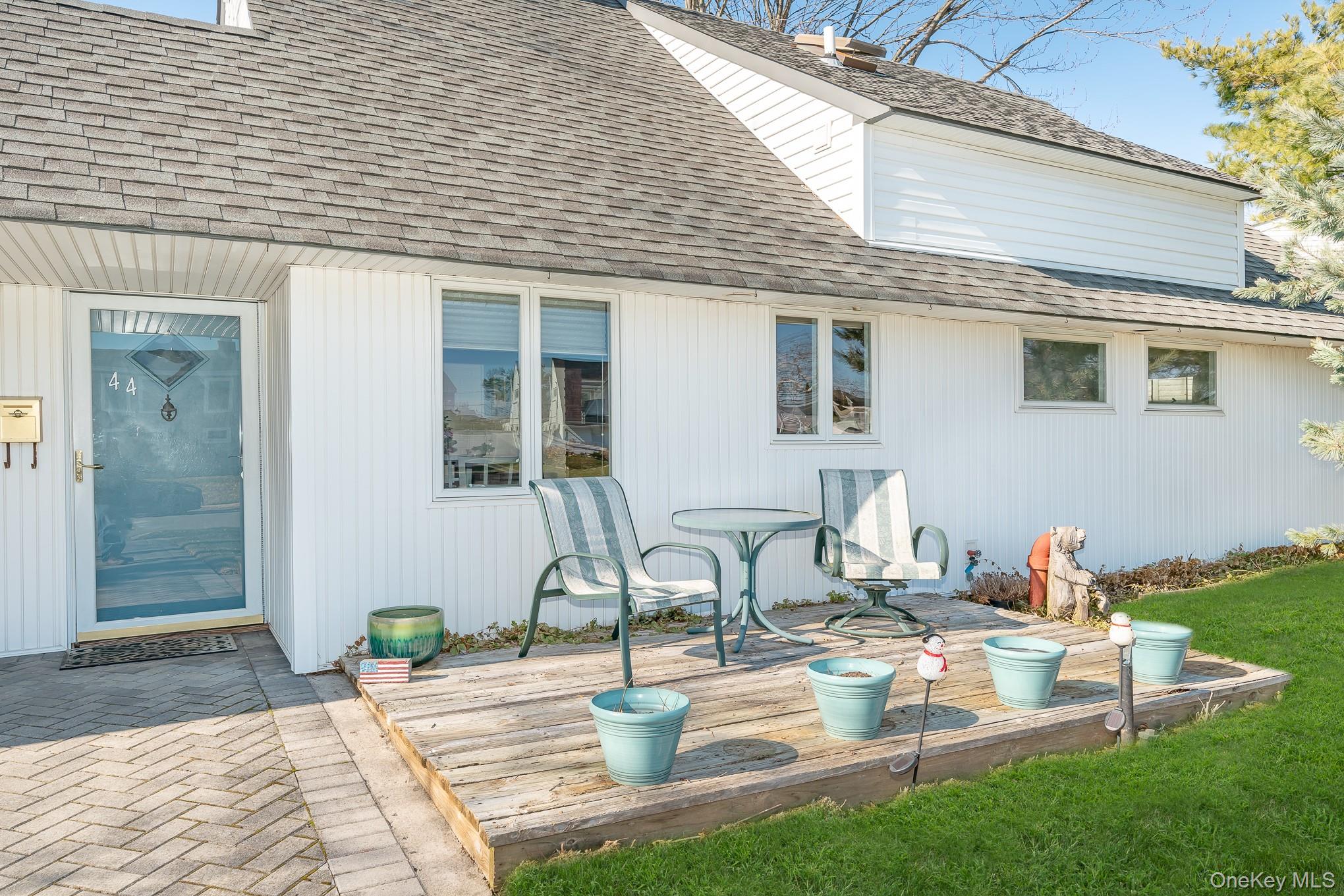 44 Disc Lane Wantagh, NY 11793 - Photo 4 of 26 a view of a house with backyard and sitting area