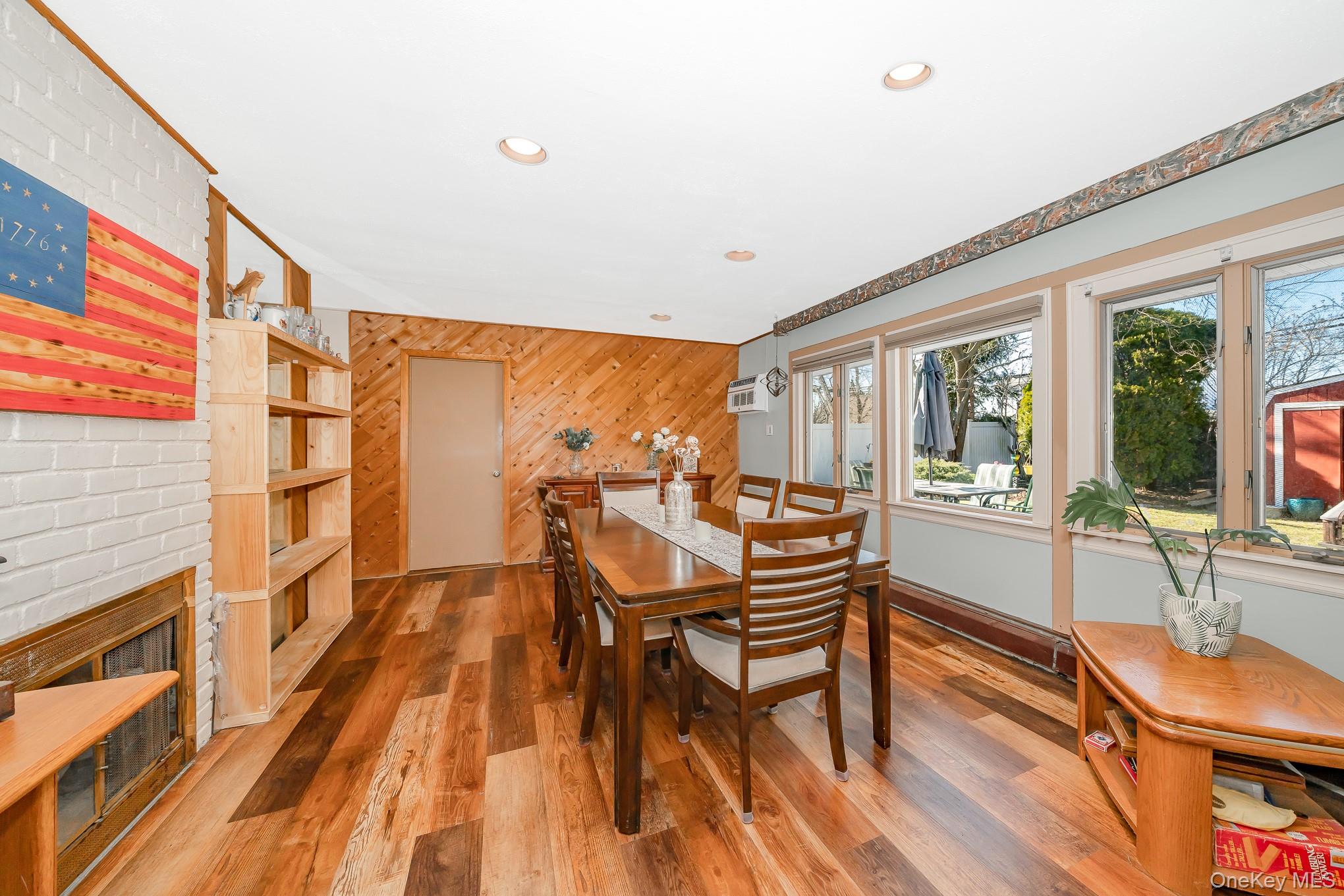 44 Disc Lane Wantagh, NY 11793 - Photo 7 of 26 a dining room with furniture and wooden floor