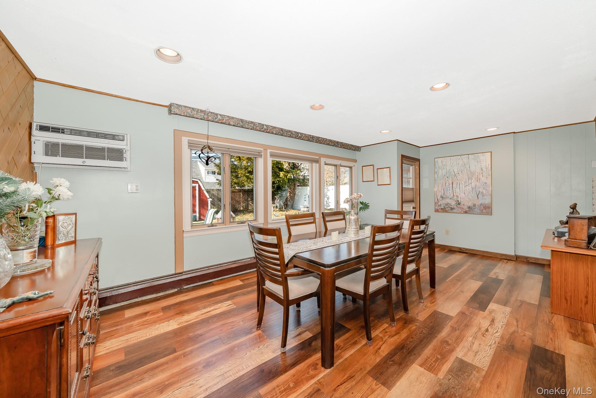 44 Disc Lane Wantagh, NY 11793 - Photo 8 of 26 a dining room with furniture and wooden floor
