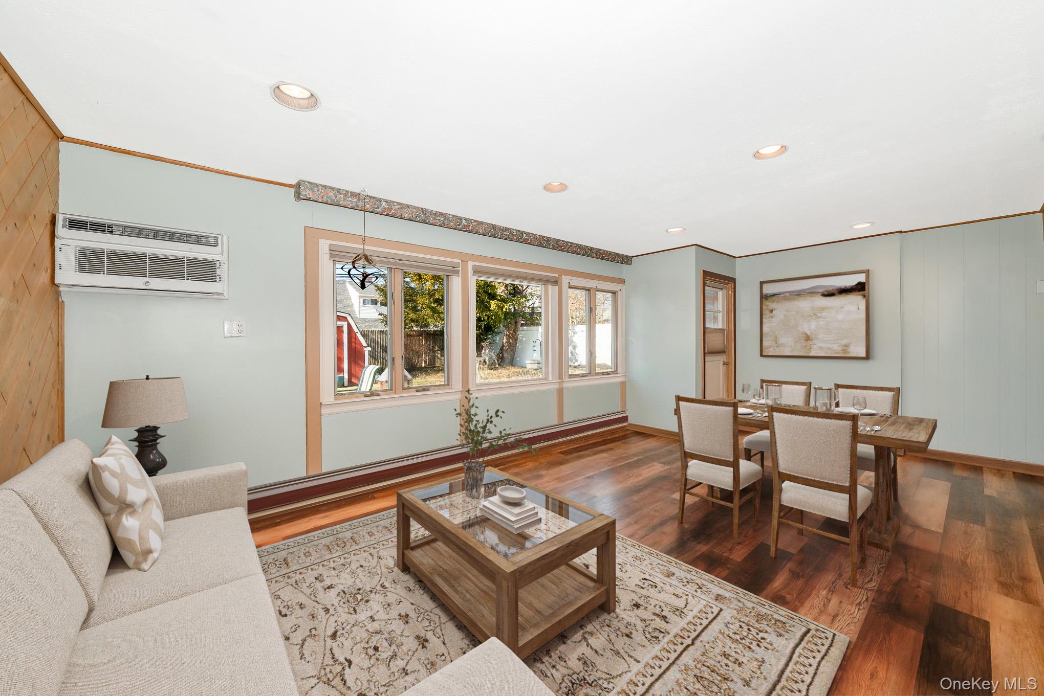 44 Disc Lane Wantagh, NY 11793 - Photo 9 of 26 a living room with furniture and wooden floor
