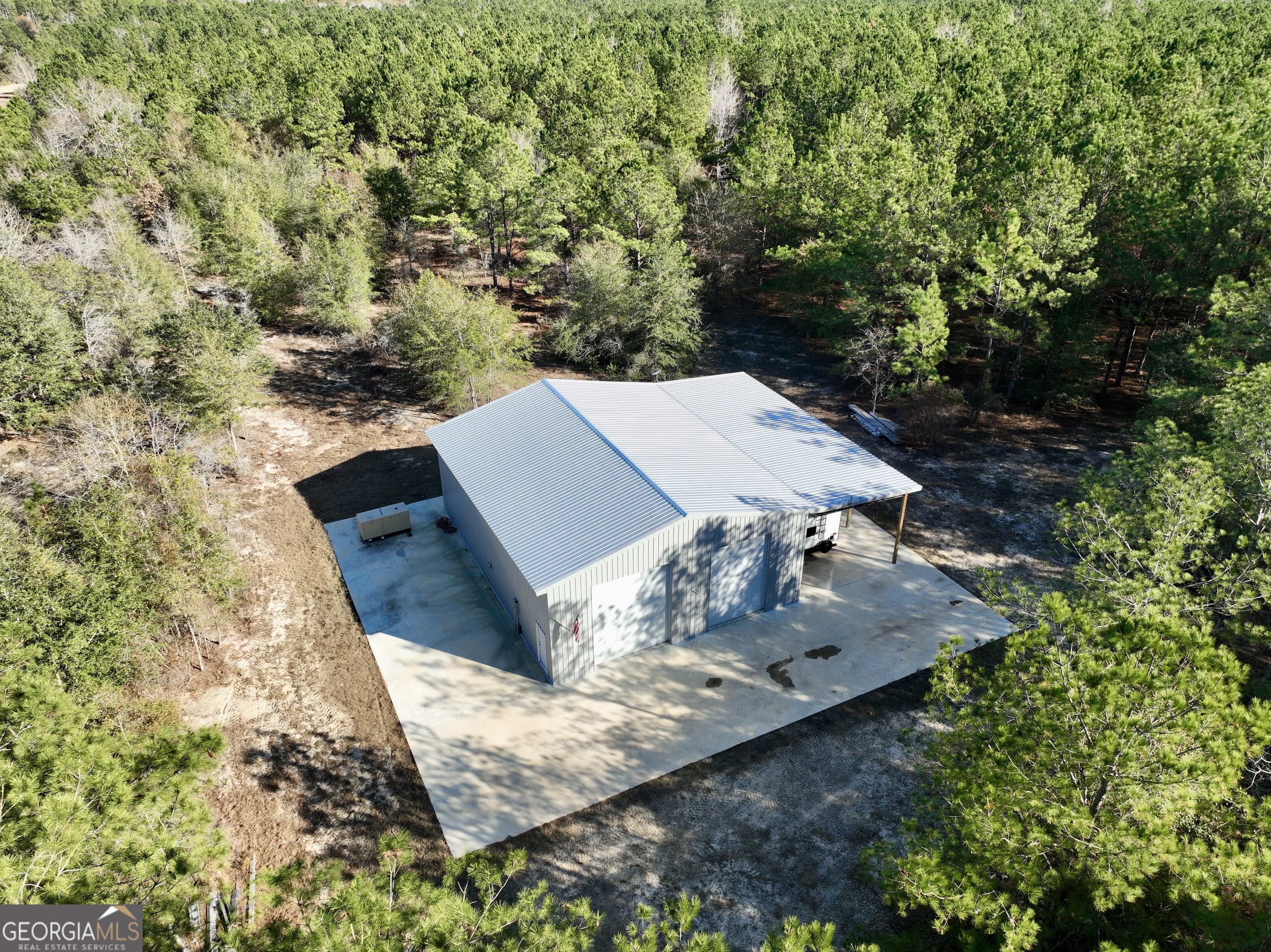 571 Sanders Cemetery Road Chauncey, GA 31011 - Photo 22 of 107 an aerial view of a house with yard
