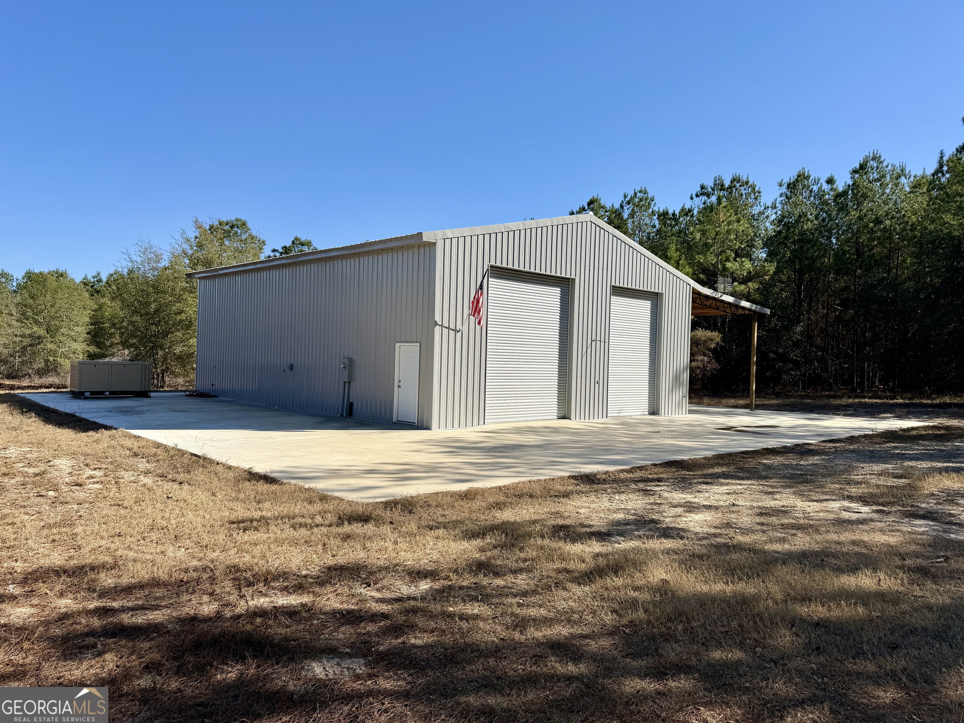 571 Sanders Cemetery Road Chauncey, GA 31011 - Photo 3 of 107 a front view of a house with a yard