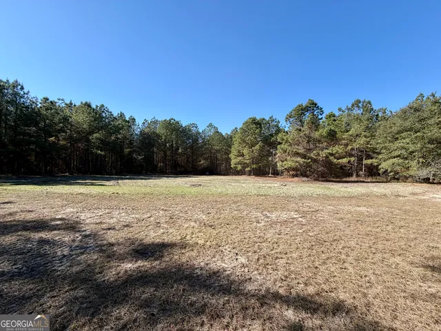 a view of a field with an outdoor space