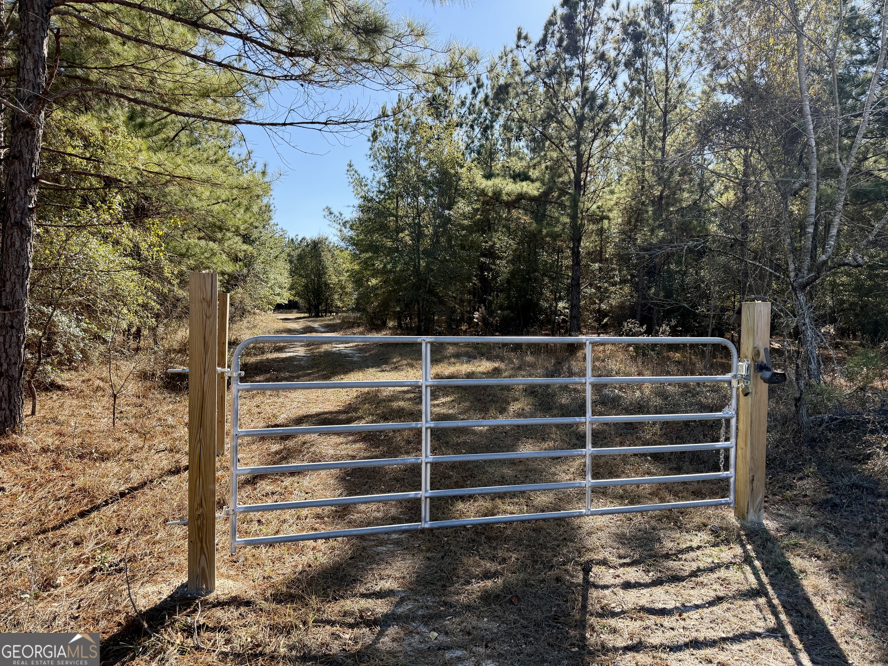 571 Sanders Cemetery Road Chauncey, GA 31011 - Photo 68 of 107 a view of an empty room with wooden floor and a chair