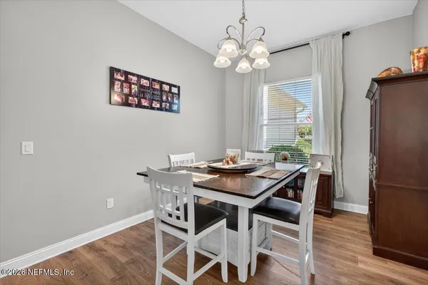 a kitchen with stainless steel appliances granite countertop white cabinets a sink and dishwasher