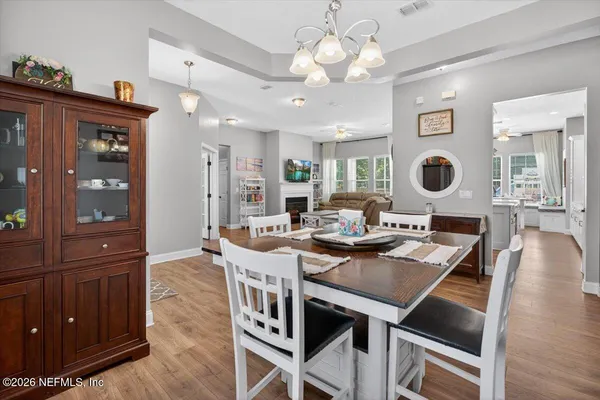 a large white kitchen with a large window