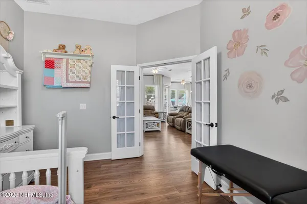 a bedroom with furniture and a window