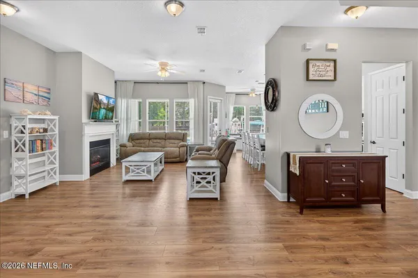 a view of a dining room with furniture window and wooden floor