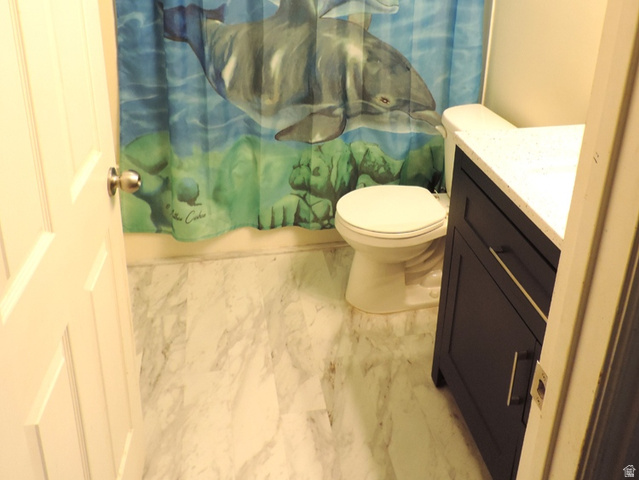 8198 North Cedar Springs Road, Unit 5 Eagle Mountain, UT 84005 - Photo 19 of 30 2nd full bath with vanity, shower / bathtub combination with curtain, and light marble finish flooring