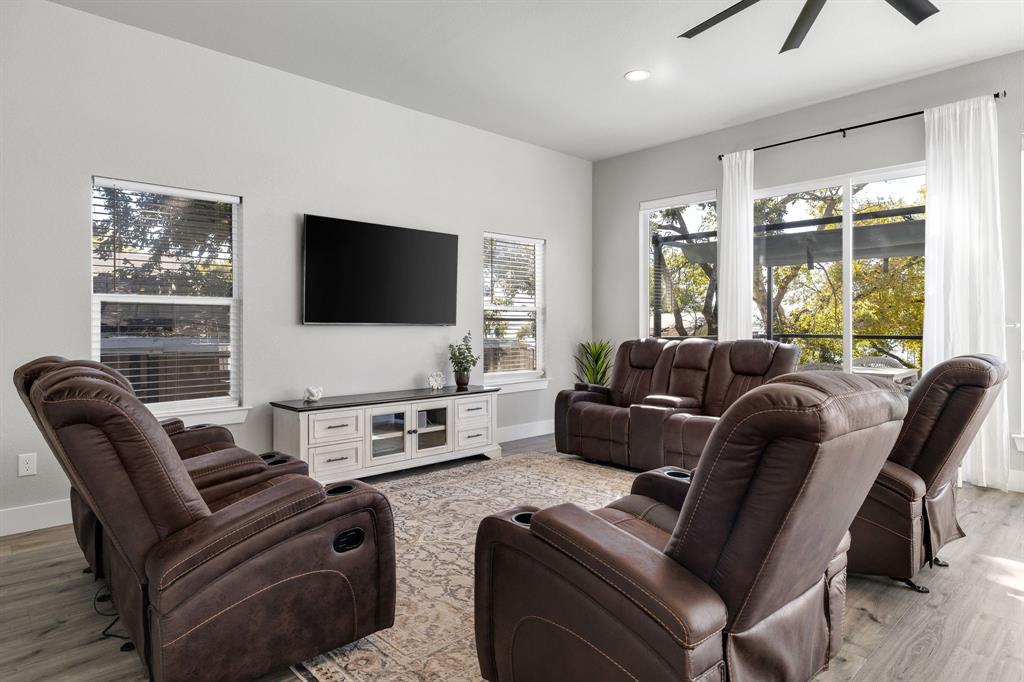 6811 Briar Road Azle, TX 76020 - Photo 12 of 34 a living room with furniture and a flat screen tv