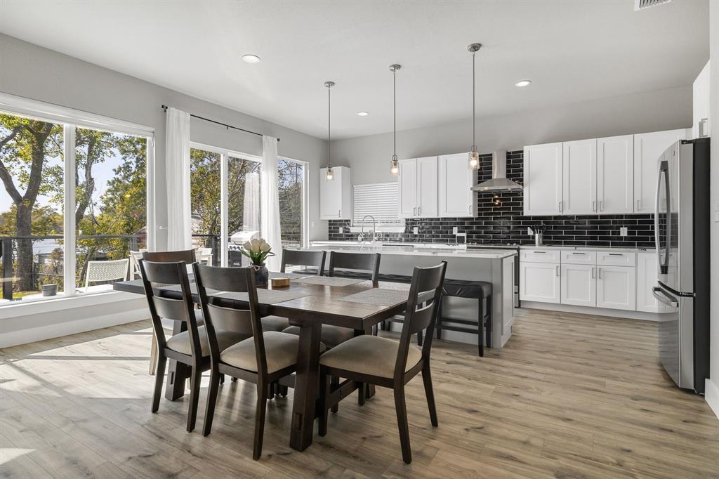6811 Briar Road Azle, TX 76020 - Photo 15 of 34 a large kitchen with a table and chairs