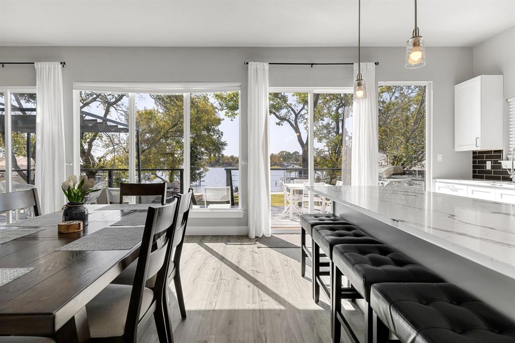 6811 Briar Road Azle, TX 76020 - Photo 16 of 34 a dining room with furniture a chandelier and wooden floor