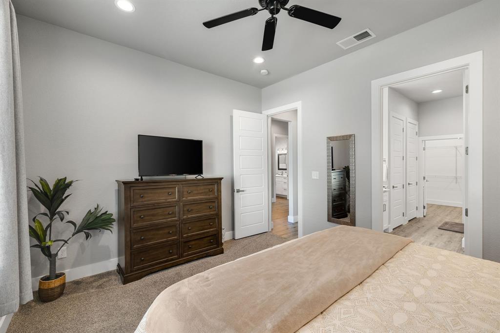 6811 Briar Road Azle, TX 76020 - Photo 6 of 34 a bedroom with a bed and a flat screen tv