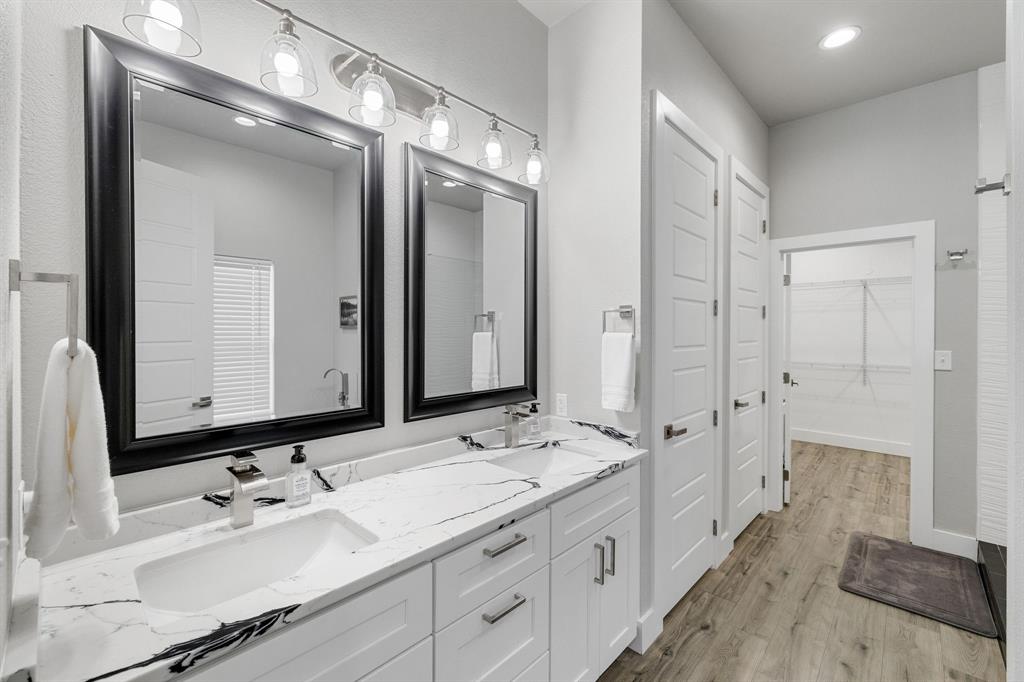 6811 Briar Road Azle, TX 76020 - Photo 7 of 34 a bathroom with a double vanity sink mirror and double