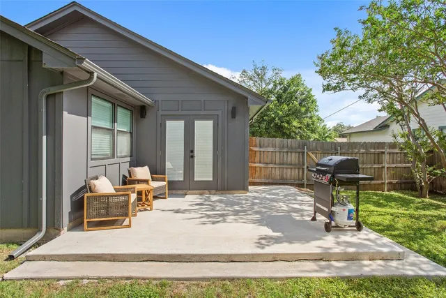 a backyard of a house with seating space