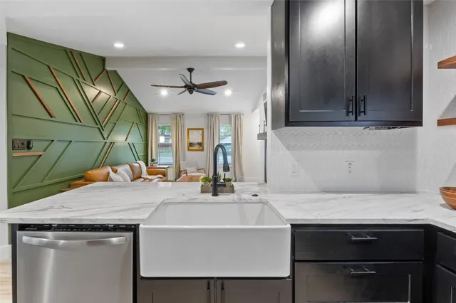 a kitchen with a stove a sink and a refrigerator