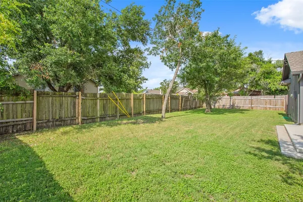 a view of a yard with a large trees