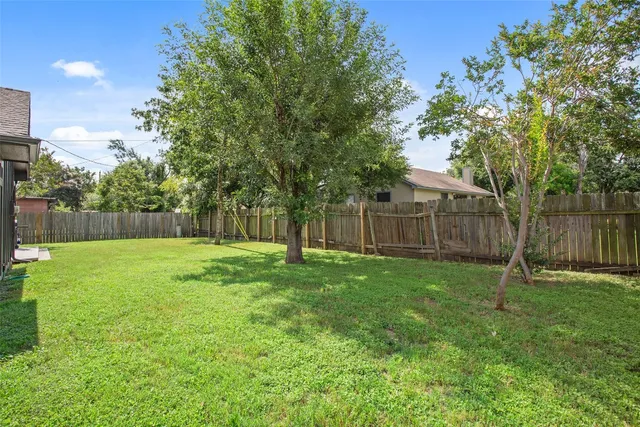 a view of a yard with a slide