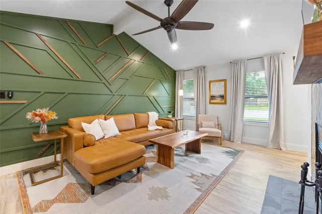 a bedroom with furniture and a chandelier