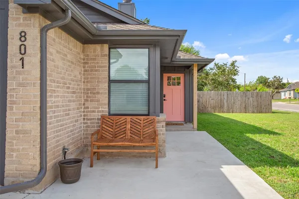 a view of backyard with outdoor seating and a garden
