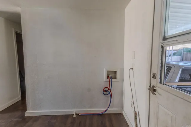 a view of a patio with couches chairs and potted plants