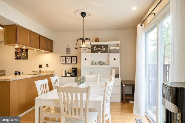 a kitchen with stainless steel appliances kitchen island granite countertop a sink and cabinets