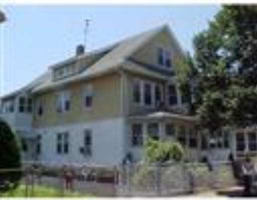 119-121 Johnson Street Springfield, MA 01108 - Photo 1 of 1 a front view of a house with a yard