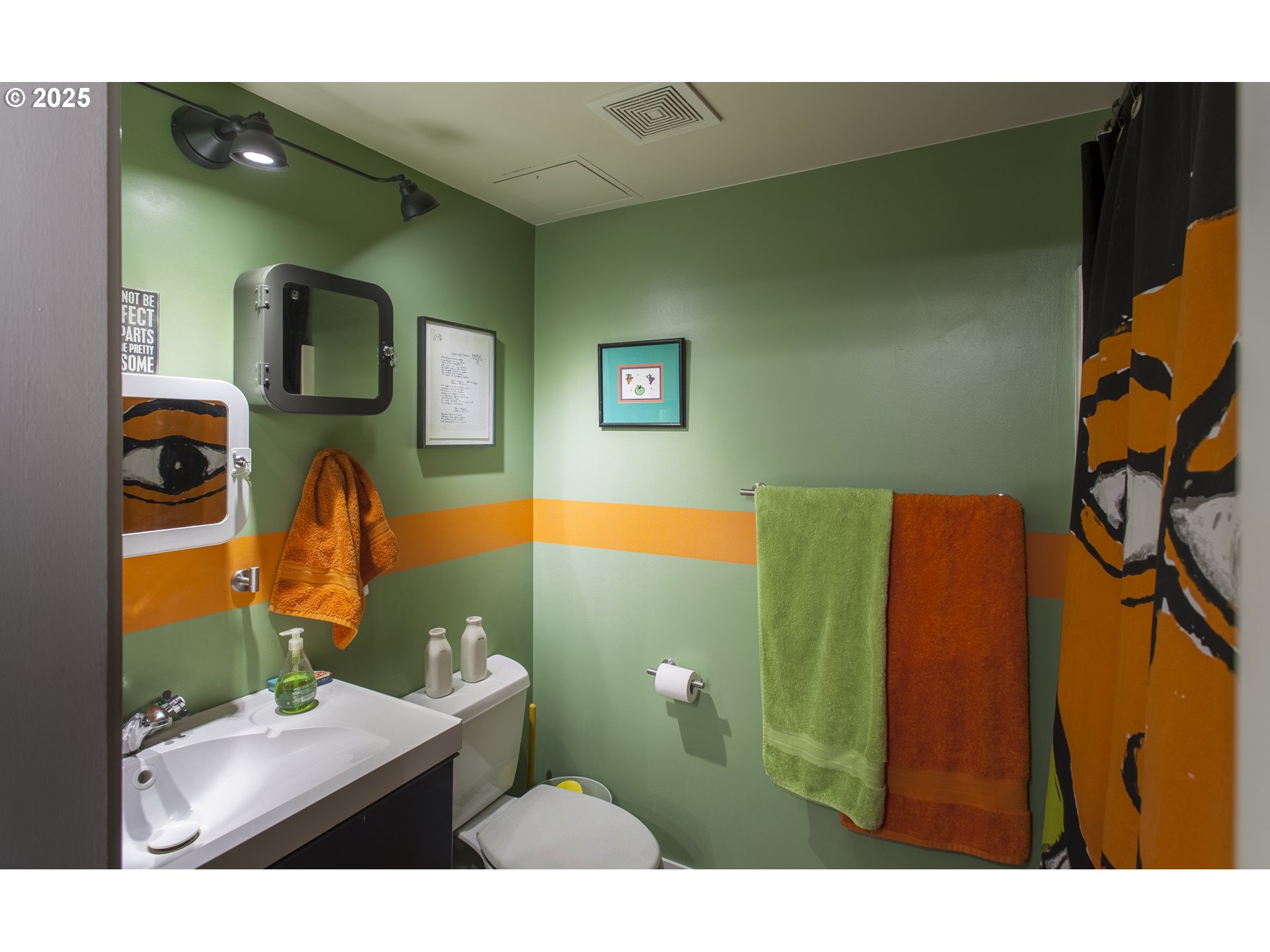 533 Northeast Holladay Street, Unit 308 Portland, OR 97232 - Photo 11 of 16 a bathroom with a sink mirror and vanity