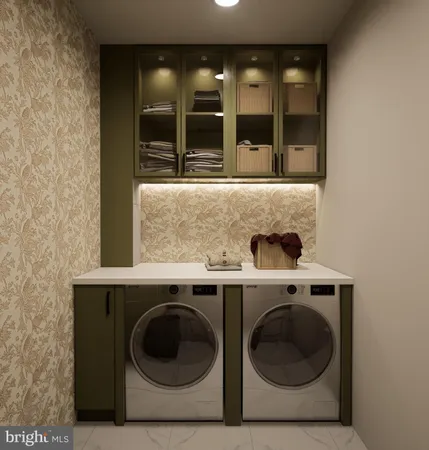 a utility room with sink dryer and washer