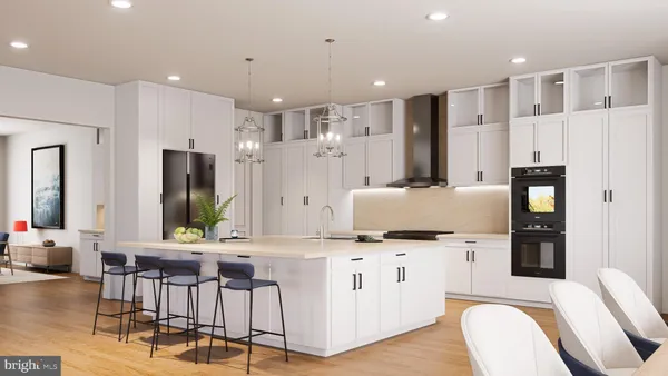 a kitchen with stainless steel appliances kitchen island granite countertop a refrigerator and a stove top oven