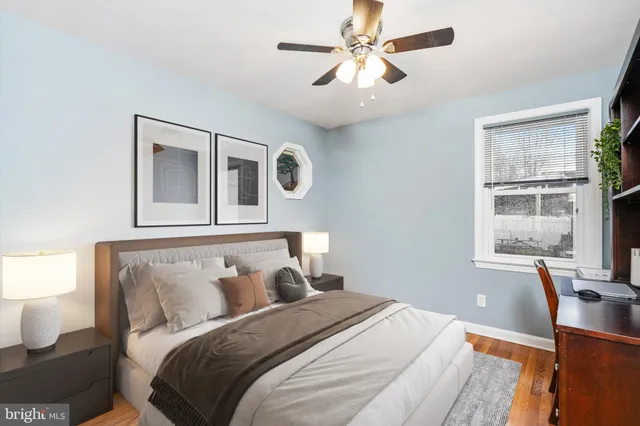 a bedroom with a large bed and a window