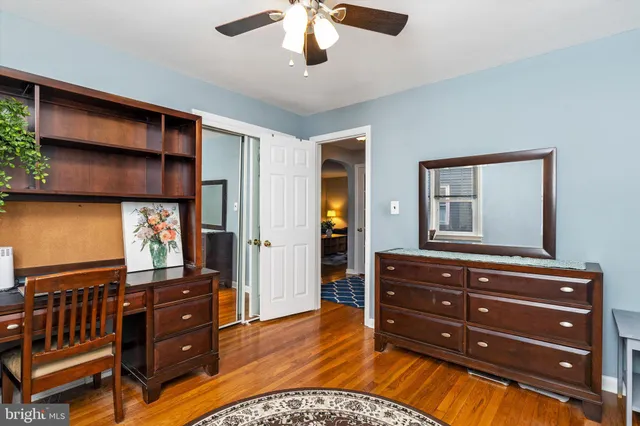 a room with a dresser and a mirror