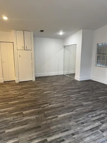 a bathroom with a toilet and a bathtub