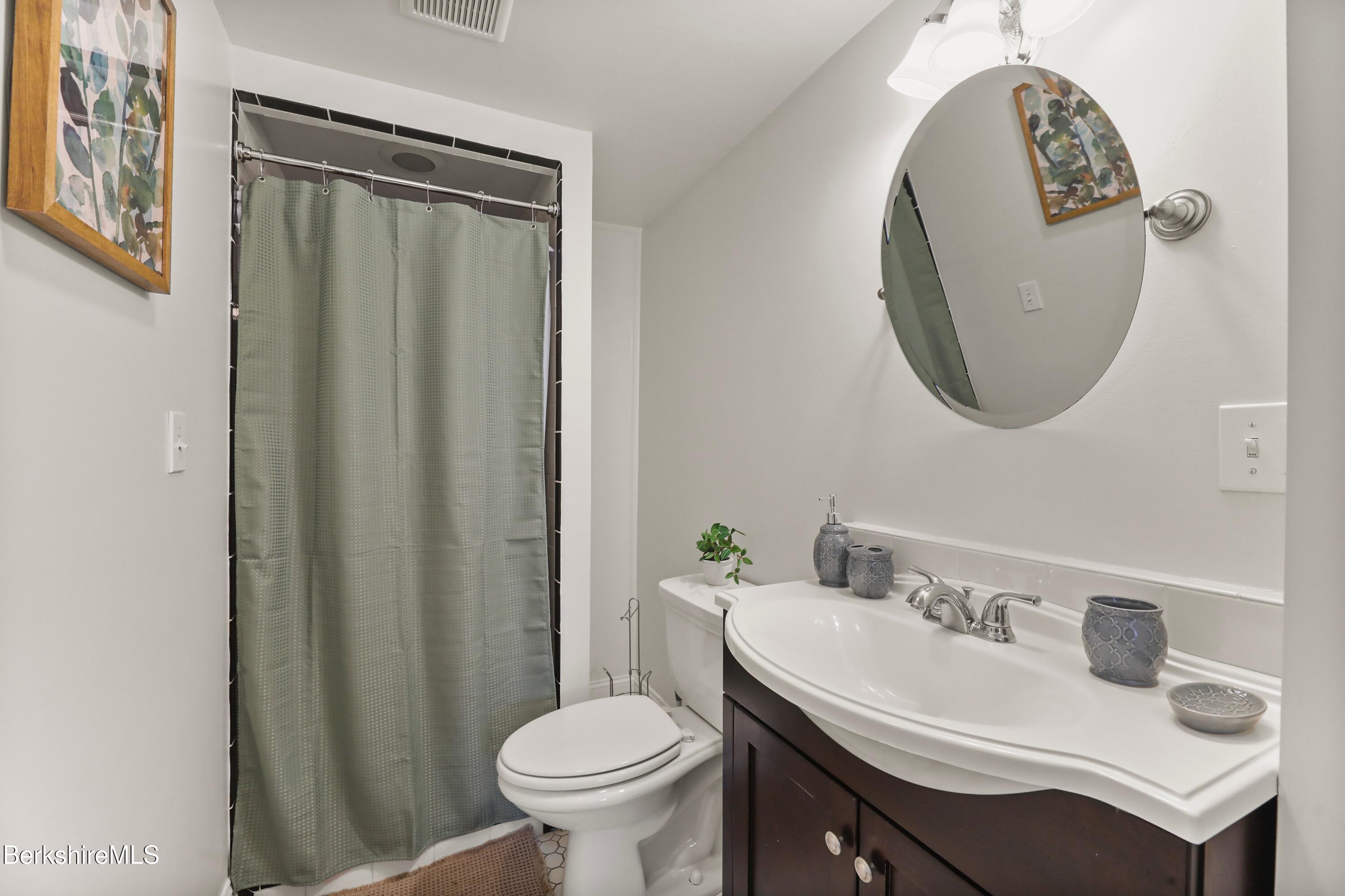 1 Devon Road Stockbridge, MA 01262 - Photo 30 of 58 a bathroom with a sink toilet and a mirror