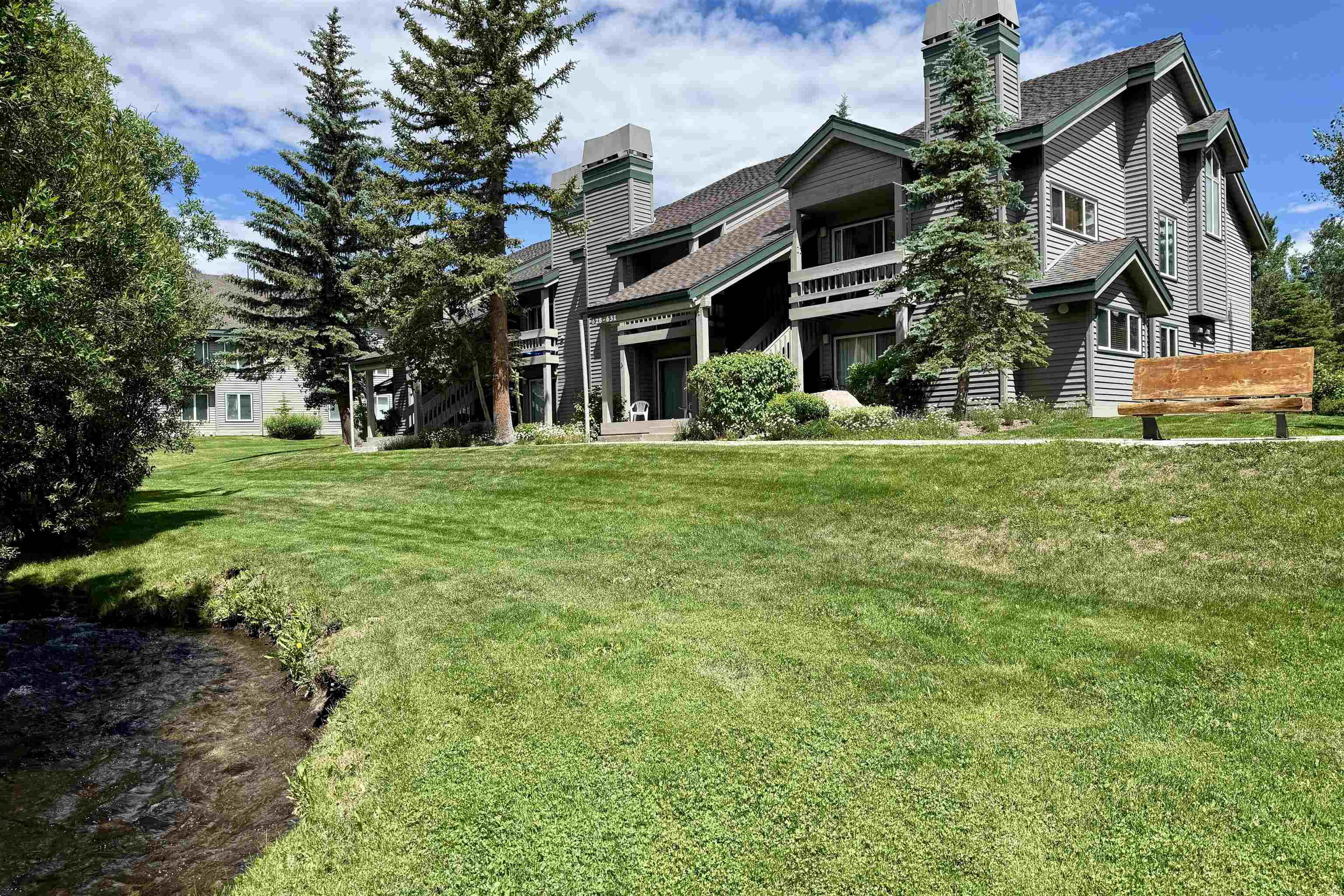 625 Golden Creek Road, Unit 625 Mammoth Lakes, CA 93546 - Photo 33 of 37 Exterior featuring multi-story siding, a gabled roof, and multiple balconies