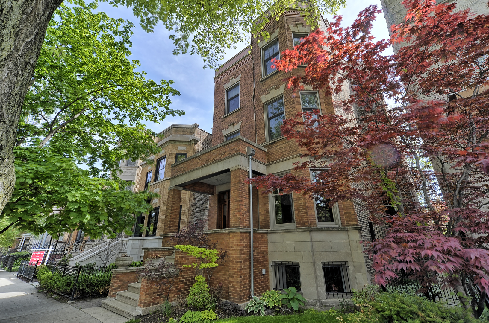 3729 North Wayne Avenue, Unit 2 Chicago, IL 60613 - Photo 1 of 12 a front view of a multi story residential apartment buildings