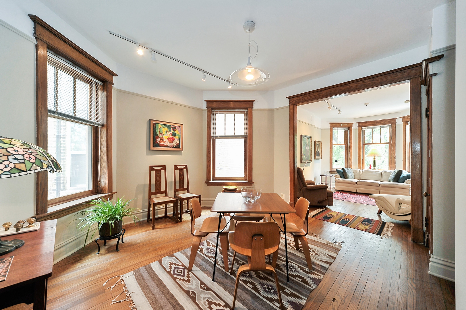 3729 North Wayne Avenue, Unit 2 Chicago, IL 60613 - Photo 2 of 12 a living room with furniture or wooden floor and a large window