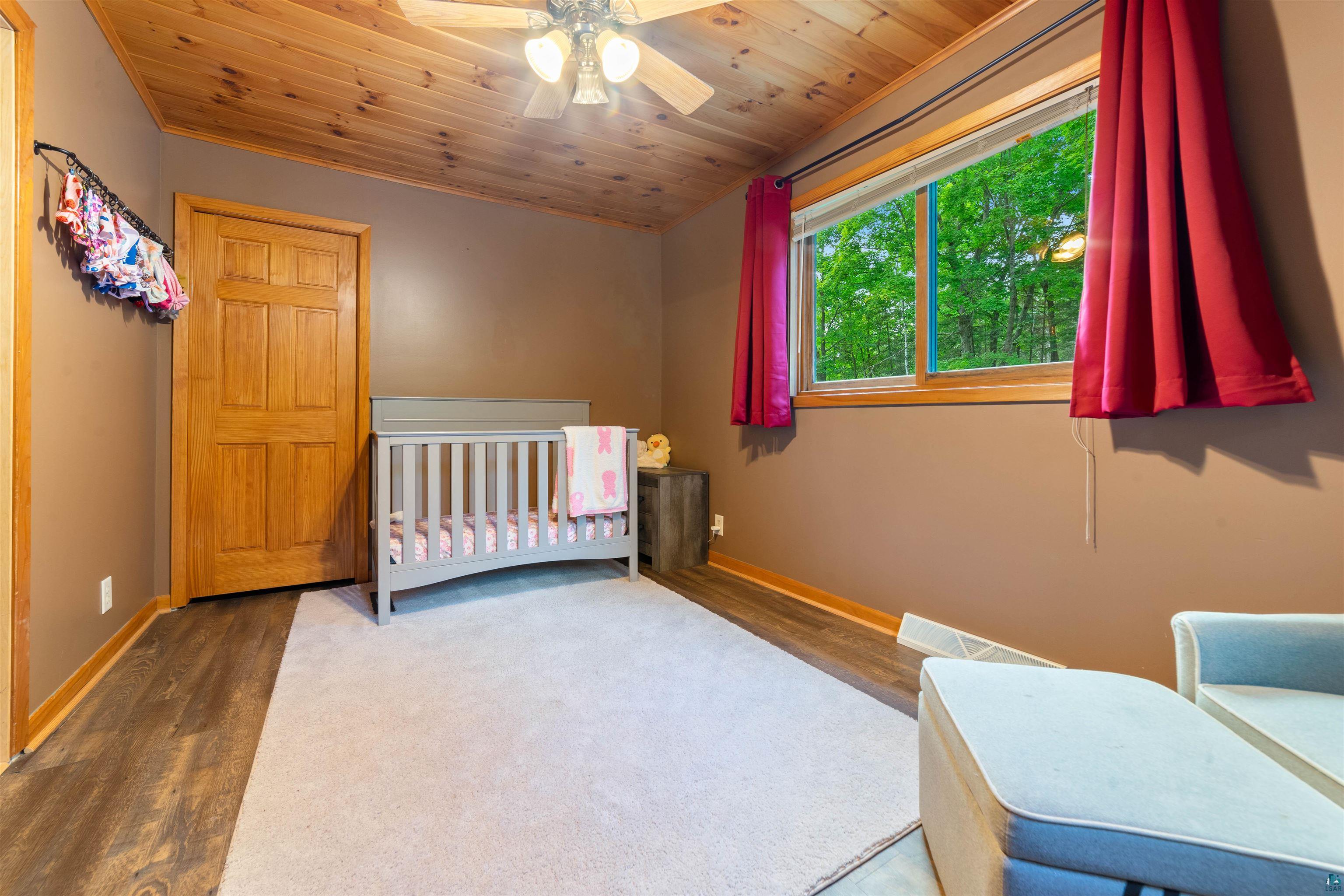 6451 Rice Lake Road Duluth, MN 55803 - Photo 14 of 31 Main floor bedroom with walk-in closet