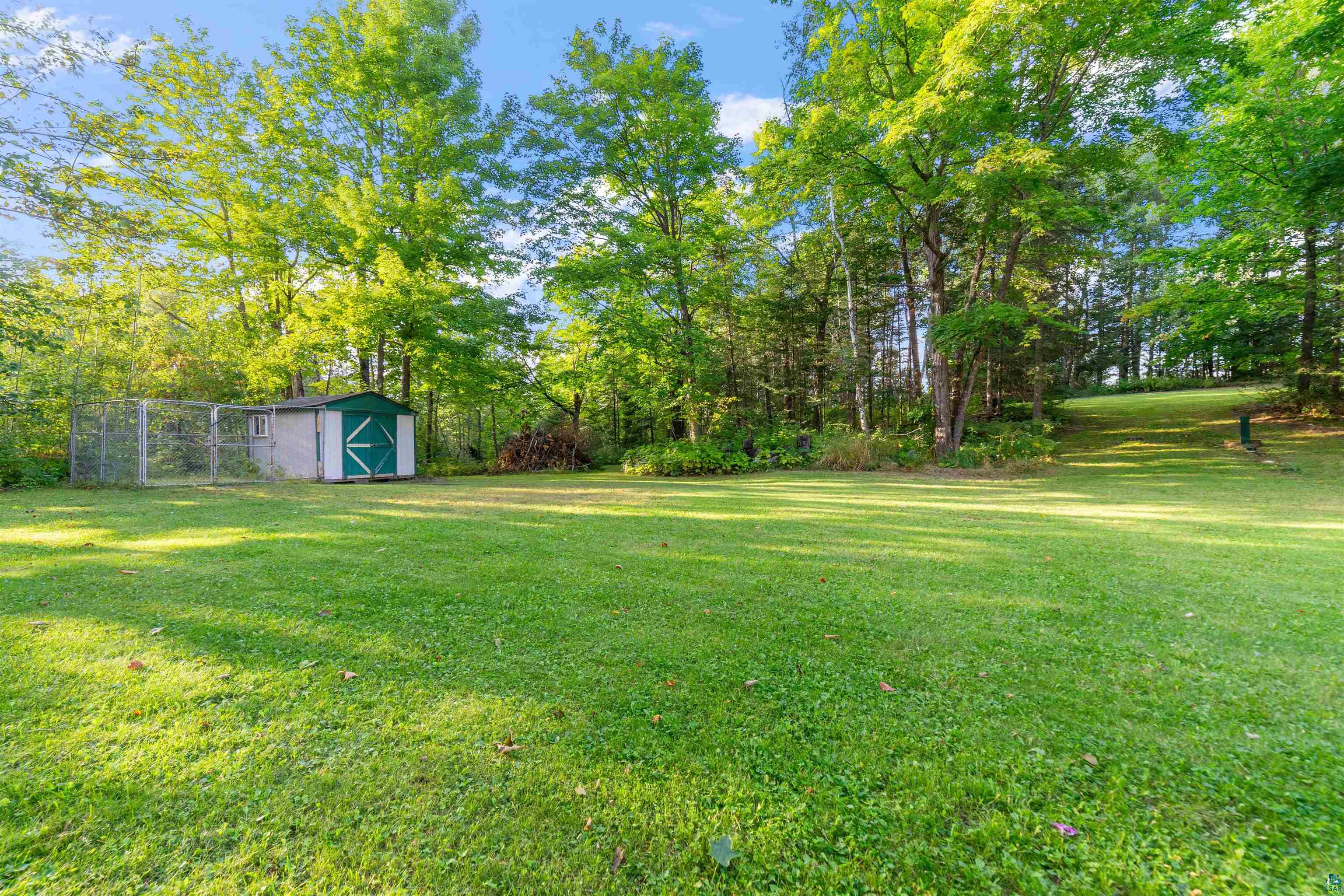 6451 Rice Lake Road Duluth, MN 55803 - Photo 25 of 31 Large backyard with shed and kennel