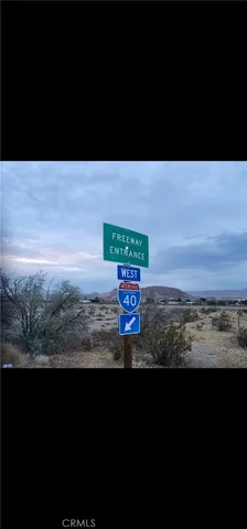 a view of a street with an ocean