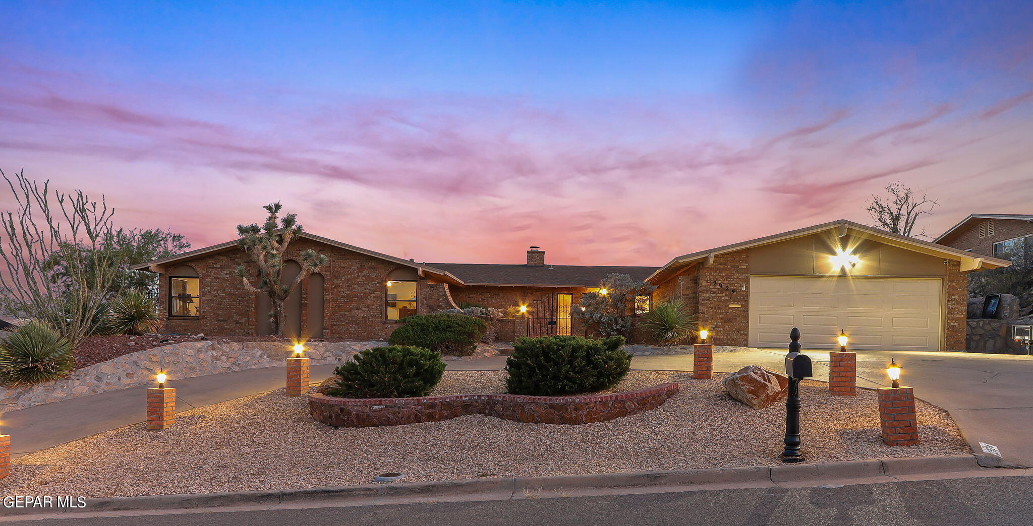 2924 Stone Edge Road El Paso, TX 79904 - Photo 1 of 1 a front view of a house with garden