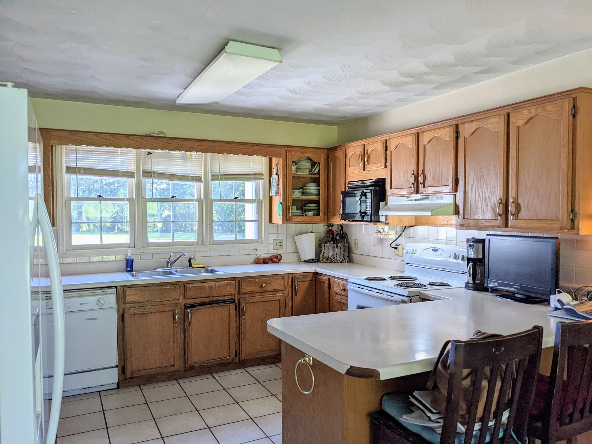 1843 Sainville Road Manchester, TN 37355 - Photo 24 of 32 a kitchen with a sink stove and cabinets