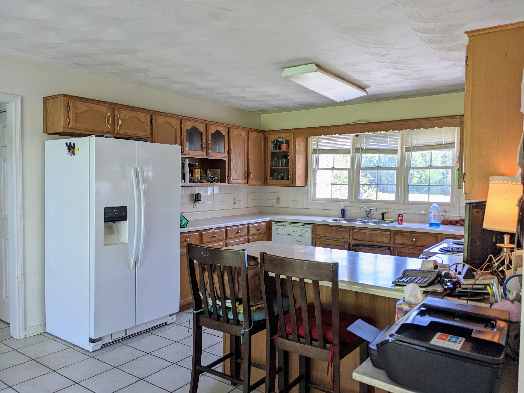 1843 Sainville Road Manchester, TN 37355 - Photo 25 of 32 a dining hall with stainless steel appliances granite countertop a refrigerator and a stove top oven