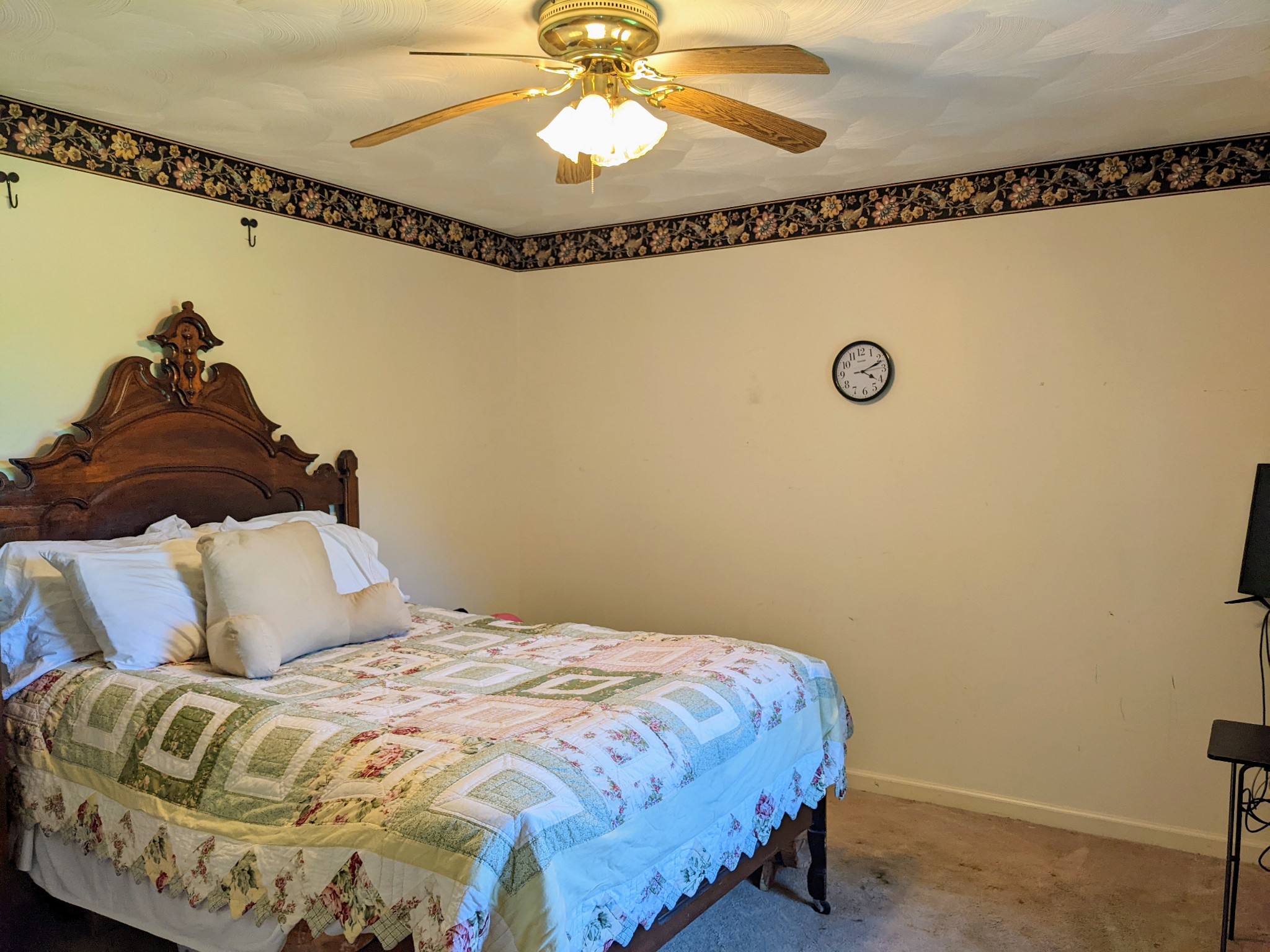 1843 Sainville Road Manchester, TN 37355 - Photo 30 of 32 a bedroom with a bed and a chandelier