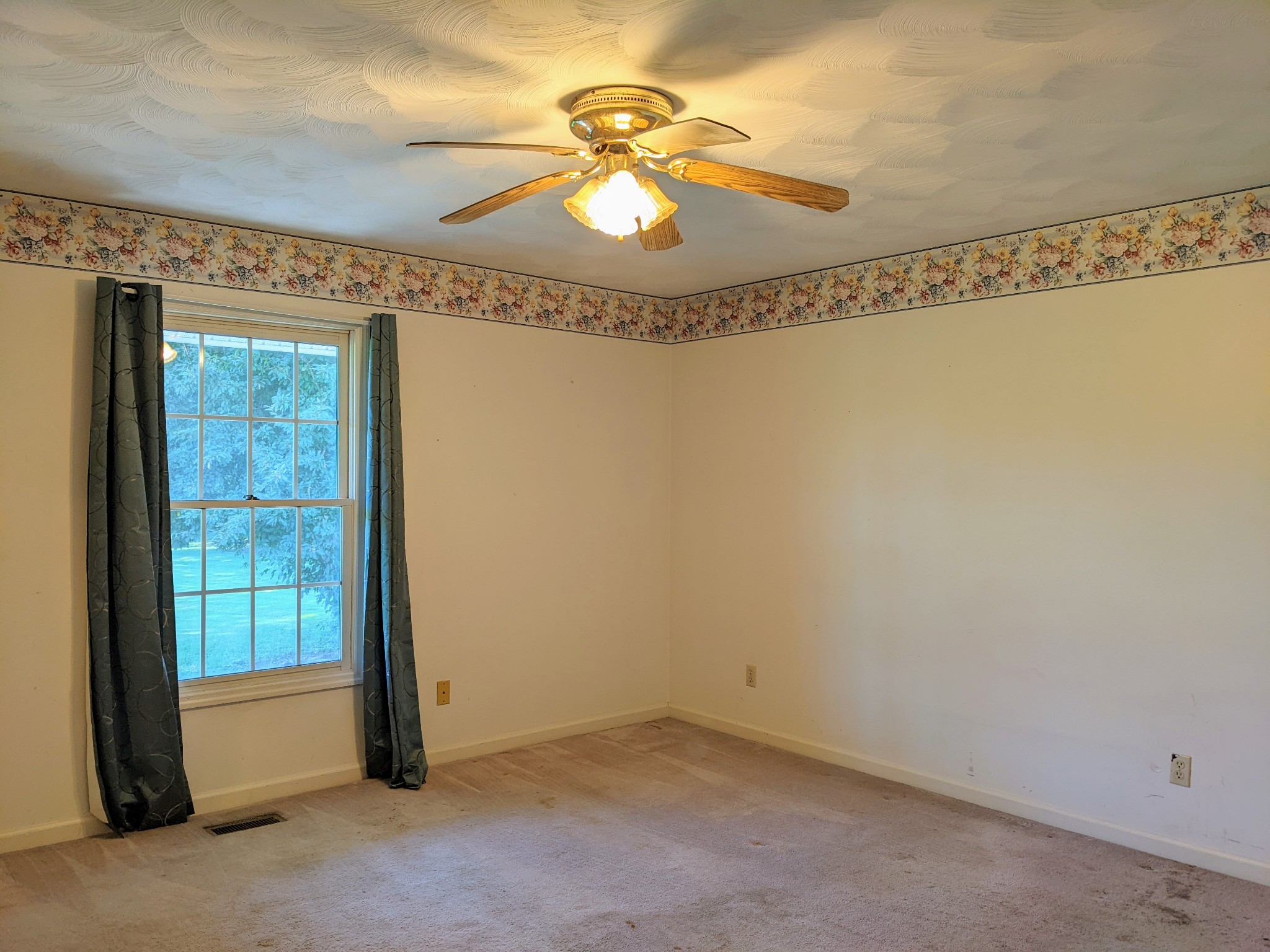1843 Sainville Road Manchester, TN 37355 - Photo 32 of 32 a view of a room with a chandelier fan and window