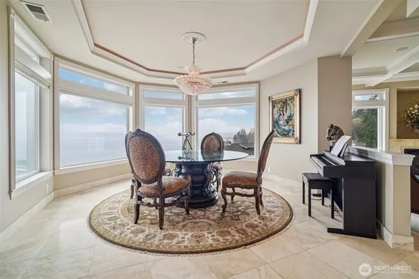 a view of a dining room with furniture window and outside view