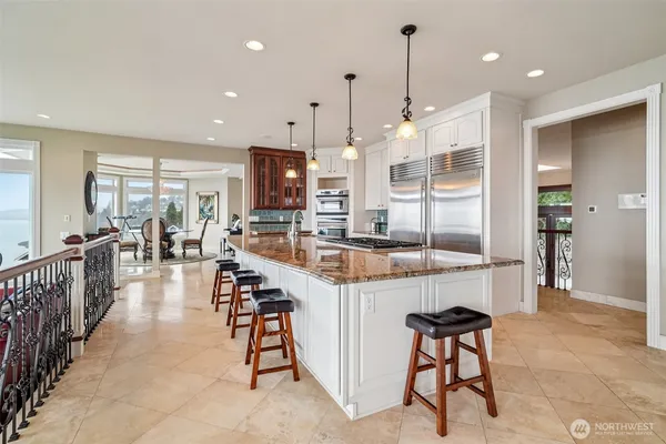 a large kitchen with lots of counter space and windows