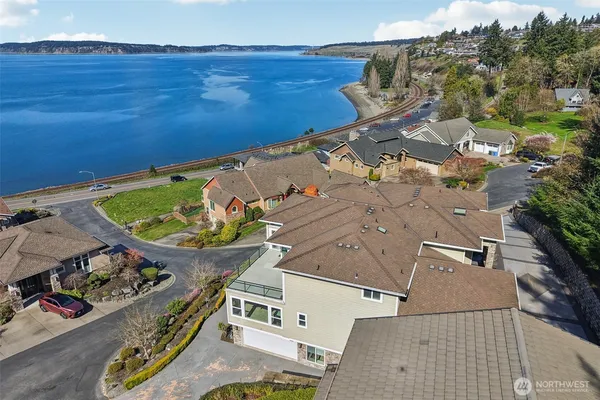 an aerial view of a house with a swimming pool