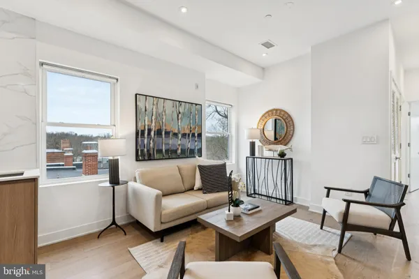 a living room with furniture and a table